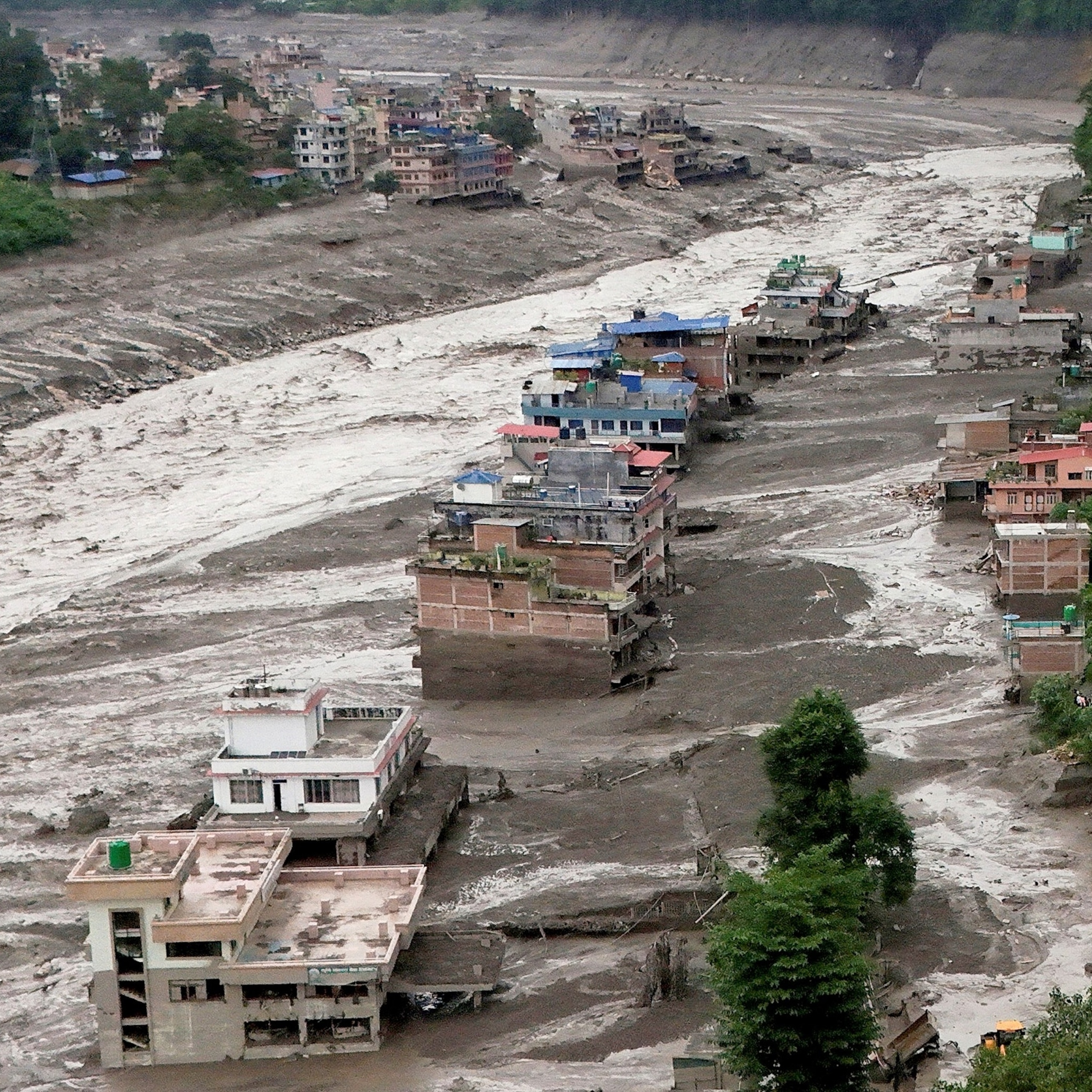 Damaged, mud-covered buildings in Nuwakot district, Nepal, on August 26, 2026